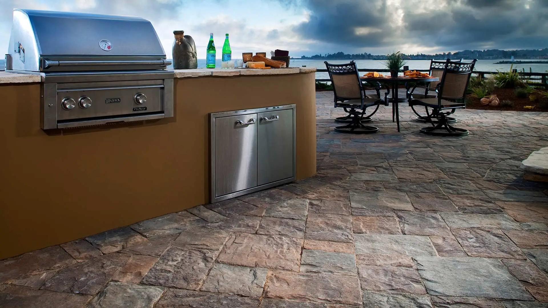 Outdoor paver kitchen with lounge seating in South Bay, CA.