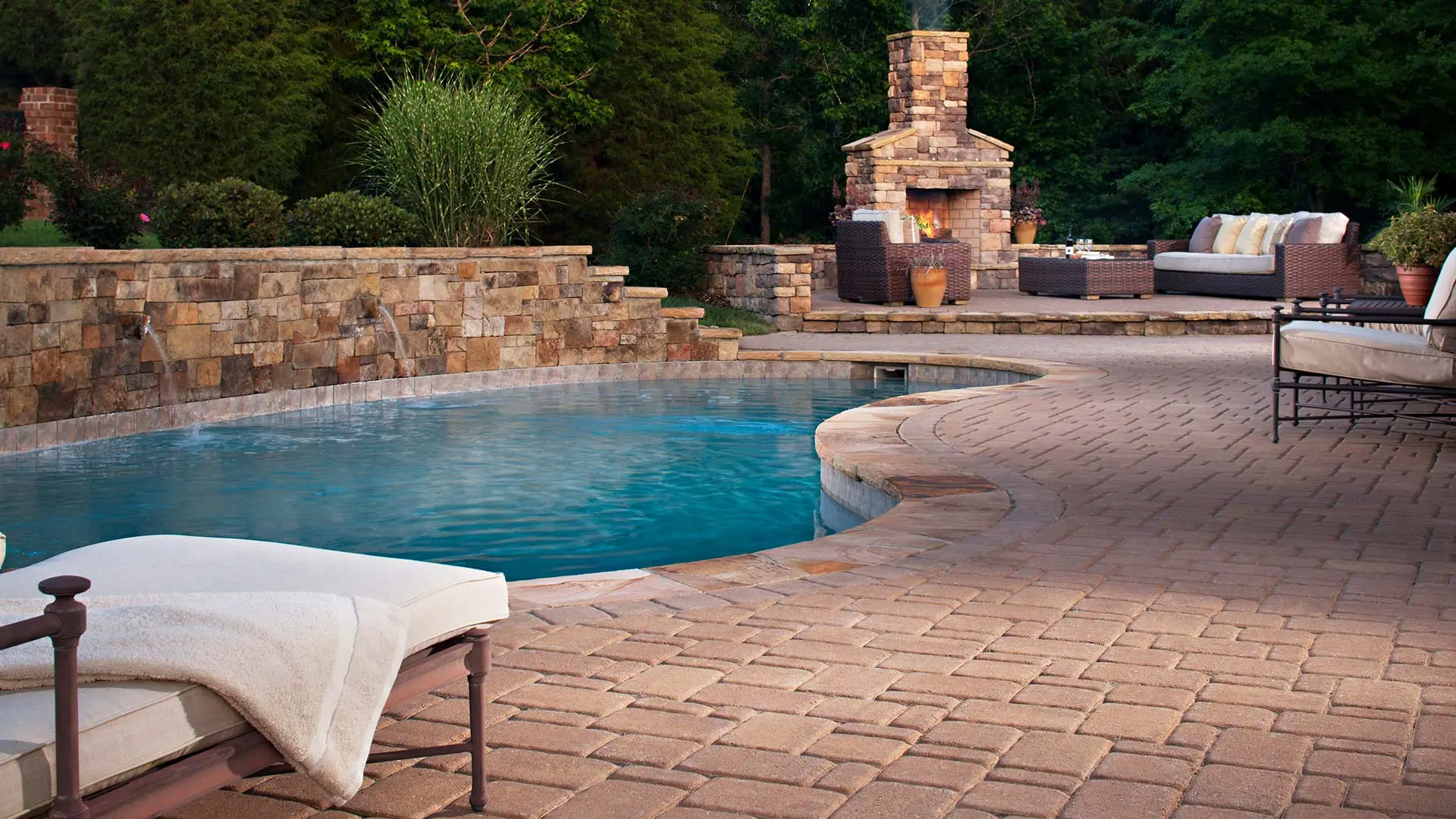 Outdoor paver pool deck with fire place in Walnut Creek, CA.
