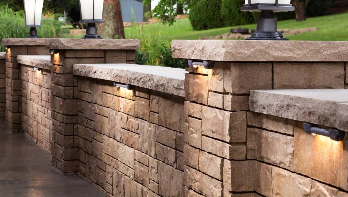 Stone retaining wall with lighting fixtures in Oakland, CA.